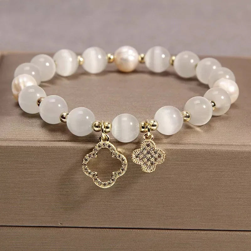 Neue Armband frauen Glück Vier-Blatt Blume Kristall Armband Elastische Seil Perle Transfer Perle Hand Kette Schmuck Armreifen geschenk