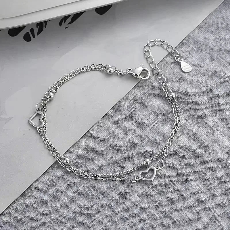 Armband aus 925er-Sterlingsilber, doppeltes Liebesherz, hohle runde Perlen, weibliche Mode, romantischer Schmuck, neue klassische verstellbare Geschenke