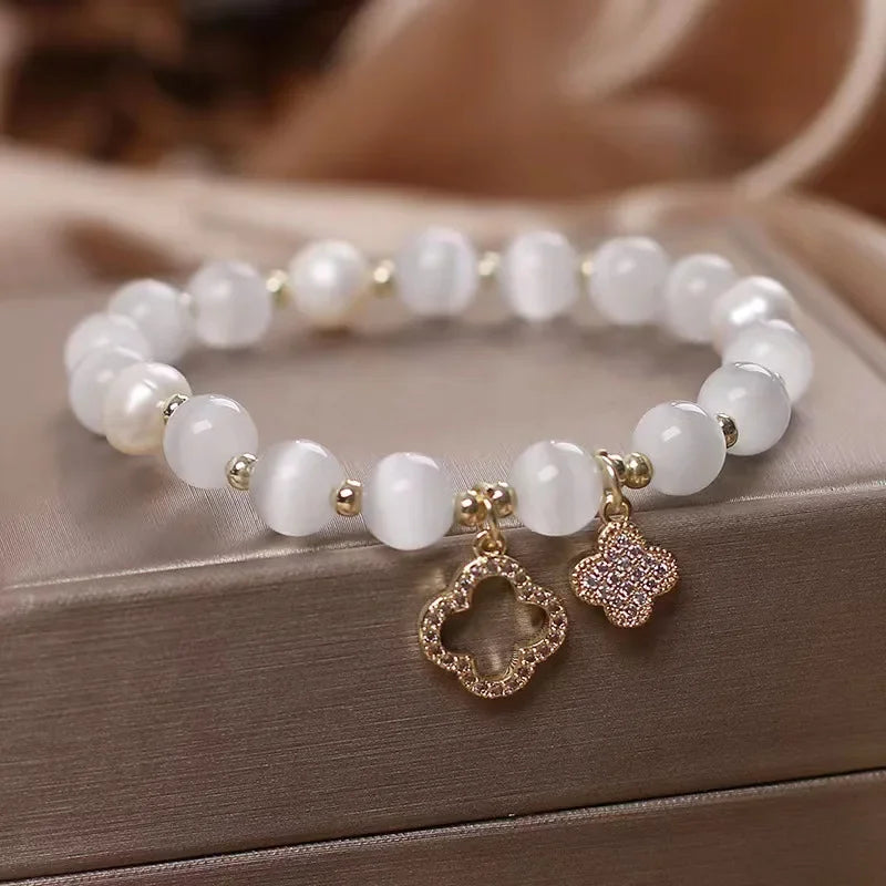 Neue Armband frauen Glück Vier-Blatt Blume Kristall Armband Elastische Seil Perle Transfer Perle Hand Kette Schmuck Armreifen geschenk