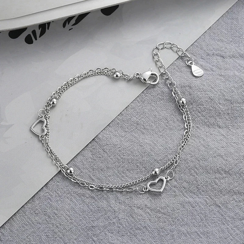 Armband aus 925er-Sterlingsilber, doppeltes Liebesherz, hohle runde Perlen, weibliche Mode, romantischer Schmuck, neue klassische verstellbare Geschenke