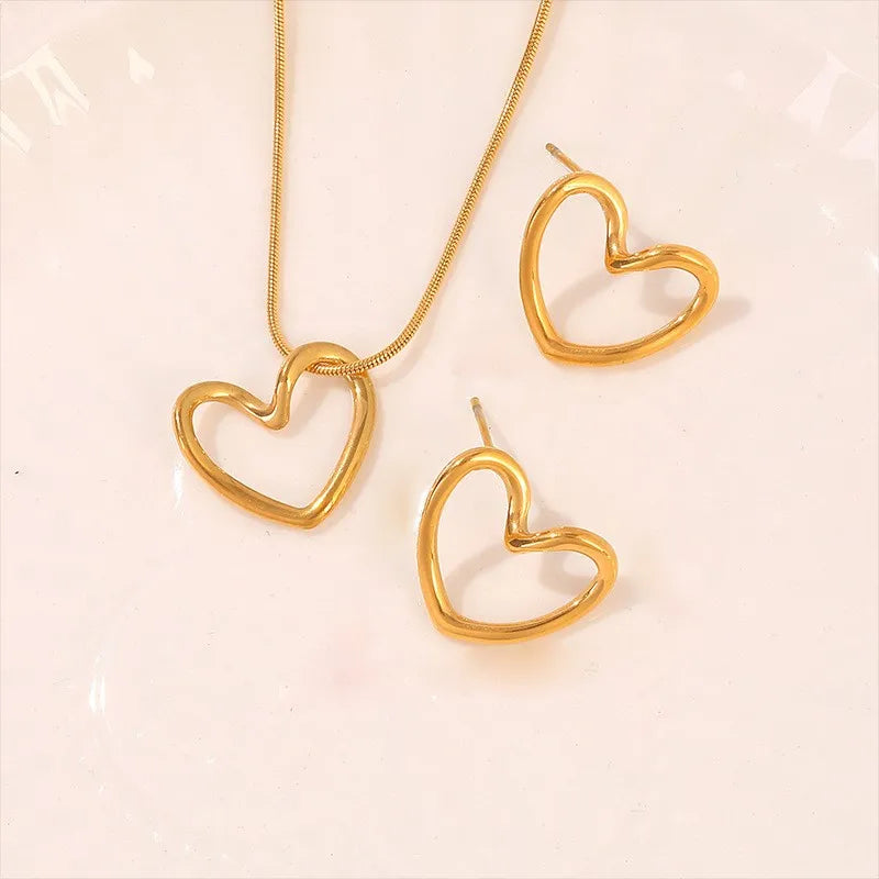 Anenjery 316l Edelstahl hohle verzerrte Herz Halskette Ohrringe für Frauen einfache Mode Schmuck Set Großhandel