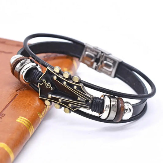 Geflochtenes Gitarrenarmband aus Zinklegierung, verstellbare Schnalle, manuell gewebtes Kunstleder, 3-lagiger Retro-Punk-Handgelenkschmuck
