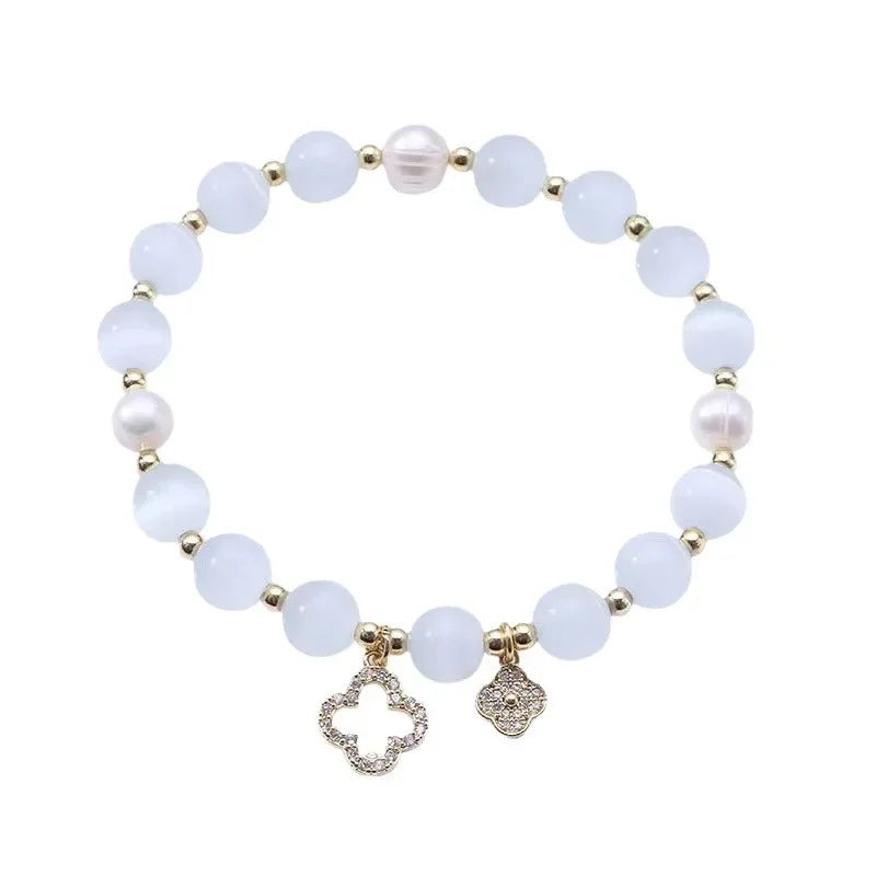 Neue Armband frauen Glück Vier-Blatt Blume Kristall Armband Elastische Seil Perle Transfer Perle Hand Kette Schmuck Armreifen geschenk
